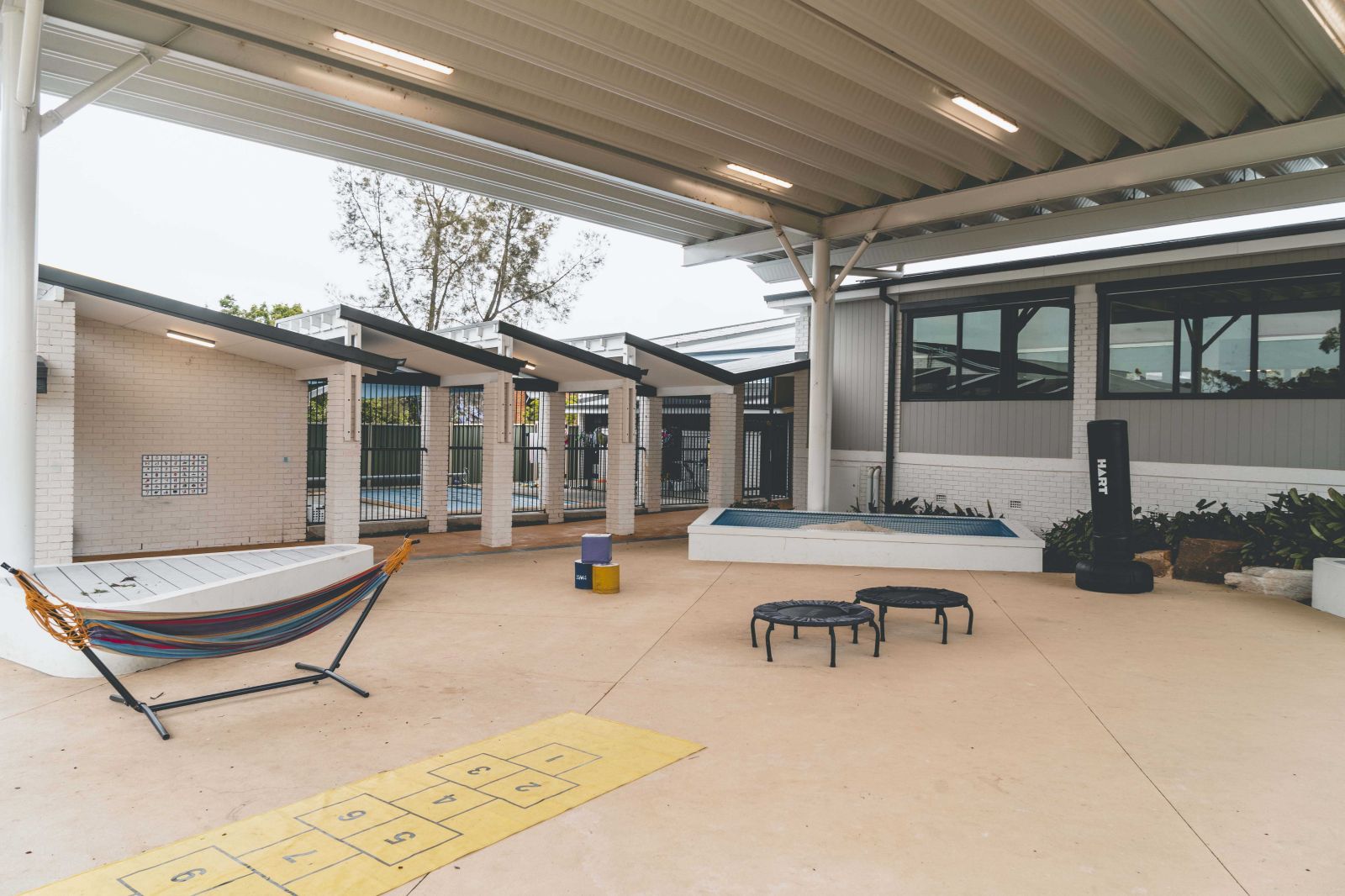 An outdoor activity area with a covered roof